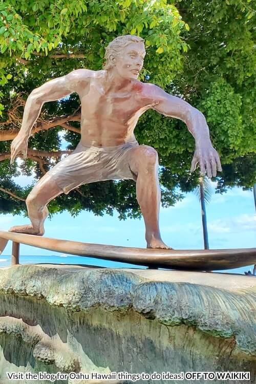surfer on a wave statue in waikiki hawaii
