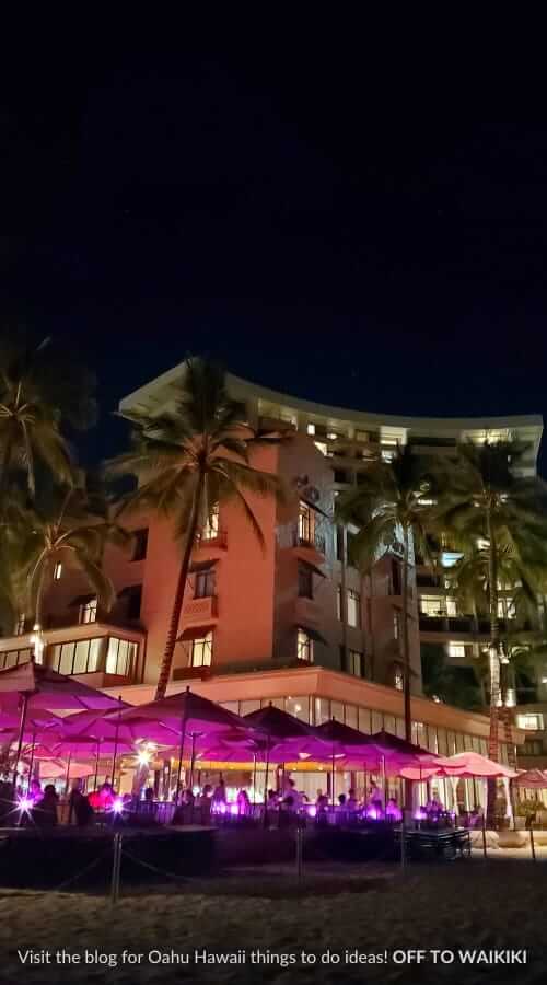 walking waikiki beach at night near royal hawaiian and moana surfrider