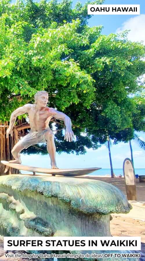 waikiki surfer statue: surfer on a wave statue at queens beach, oahu hawaii